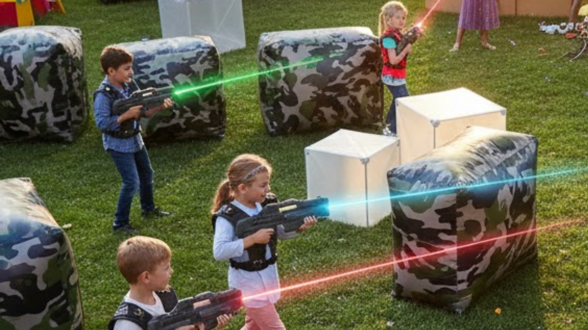 Children dressed in themed attire (e.g., camouflage or sci-fi gear) playing laser tag, illustrating creative outdoor birthday party themes for laser tag.